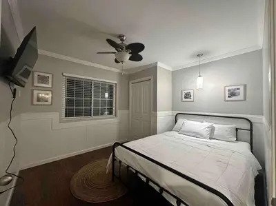a bedroom with a bed and a ceiling fan at HC Accessible 4 Bed 3 Bath with Sparkling Pool and Spa-we have lifts and roll in shower in Santee