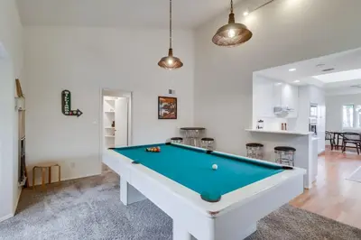 a living room with a pool table in it at Ocean & Bay Views Pool & Hot Tub Rooftop Patio in San Diego
