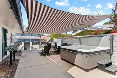 a hot tub on the patio of a house at California Dreamin at O'side Palms in Oceanside