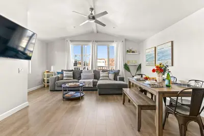 a living room with a couch and a table at Prime Mission Beach Getaway in San Diego