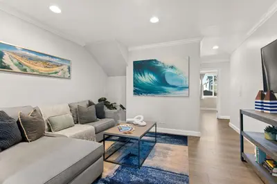 a living room with a couch and a table at Prime Mission Beach Getaway in San Diego