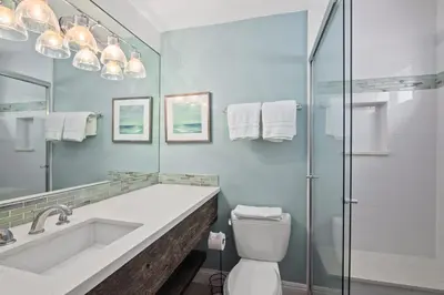 a bathroom with a sink and a toilet and a shower at Coastal Chic at Windansea in San Diego