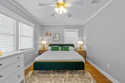 a bedroom with a bed and a ceiling fan at Bankers Hill Hideaway with AC Views and Parking in San Diego
