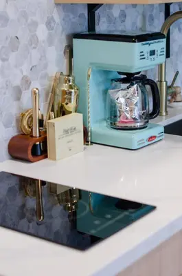 a kitchen shelf with a blue blender on it at The Boardwalk Hotel in San Diego