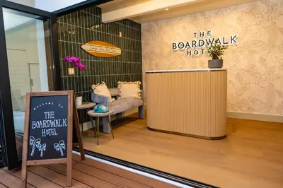 a shop window with a bench and a sign at The Boardwalk Hotel in San Diego