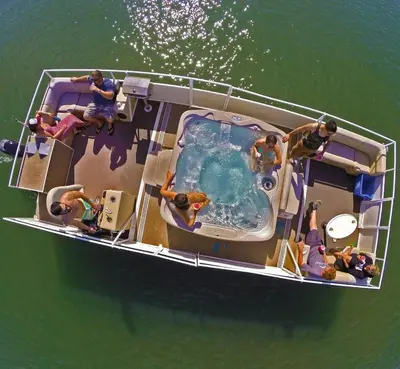 a group of people on a boat with a swimming pool at The Boardwalk Hotel in San Diego