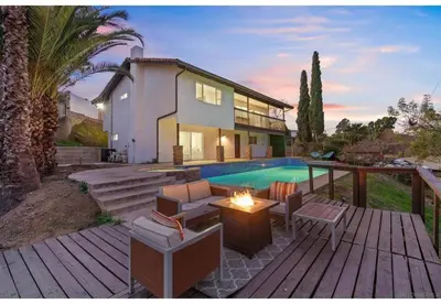a home with a swimming pool and a house at Hidden Oasis Near Safari - Wineries - Lakes in Escondido
