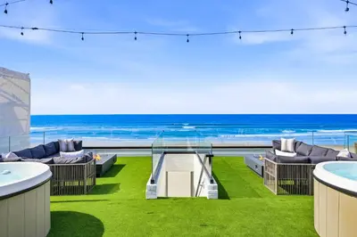 a balcony with a view of the ocean at N Oceanfront Masterpiece with Rooftop & Hot Tub in San Diego