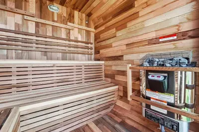 a sauna with wooden walls and benches in a cabin at N Oceanfront Masterpiece with Rooftop & Hot Tub in San Diego