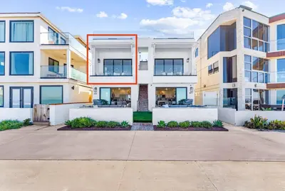 an apartment building with a red frame on it at N Oceanfront Masterpiece with Rooftop & Hot Tub in San Diego