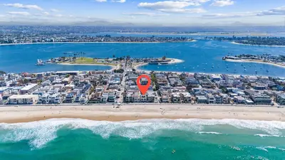 an aerial view of a beach with a red balloon at N Oceanfront Masterpiece with Rooftop & Hot Tub in San Diego