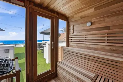 a sauna with a view of the ocean at Luxury oceanfront fourplex with roof deck sleeps 22 in San Diego
