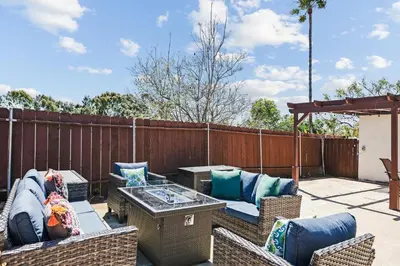 a patio with wicker chairs and a table at Peaceful Getaway with Renovated Amenities in San Diego