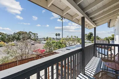 a balcony with chairs and a view of the city at Peaceful Getaway with Renovated Amenities in San Diego