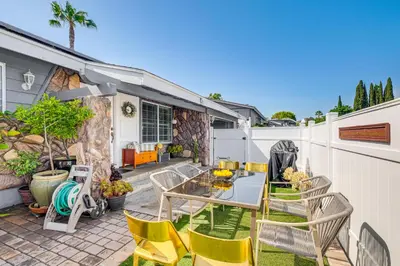 a patio with chairs and a table and a fence at Peaceful Poway Vacation Rental Near Shops and Dining in Poway