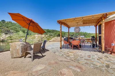 a patio with an umbrella and a table and chairs at Mystical Mongolian Yurt in Fallbrook with Views! in Temecula