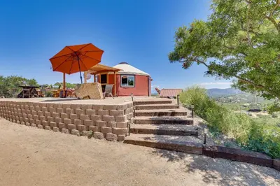 a set of stairs with an umbrella and a house at Mystical Mongolian Yurt in Fallbrook with Views! in Temecula
