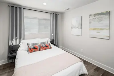 a bedroom with a white bed and a window at Modern 1 BR Beach Waves and Sunshine in San Diego