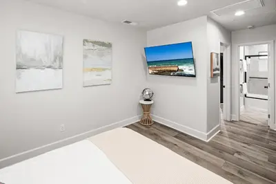 a white room with paintings on the wall at Modern 1 BR Beach Waves and Sunshine in San Diego