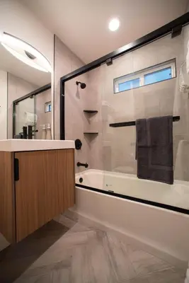 a bathroom with a tub and a glass shower at 5BD Family, Event Friendly 4plex Steps2Beach in San Diego