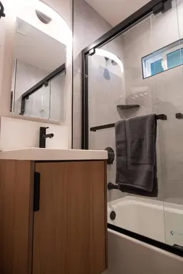 a bathroom with a sink and a shower and a tub at 5BD Family, Event Friendly 4plex Steps2Beach in San Diego