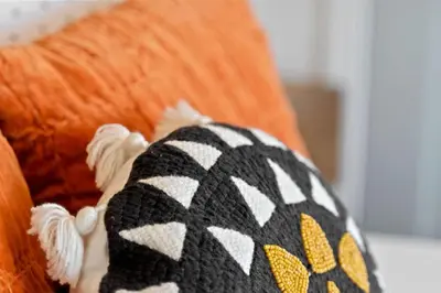 a stuffed animal animal wearing a knit hat on a couch at North Park Boho Bungalow by Rather Be Properties in San Diego