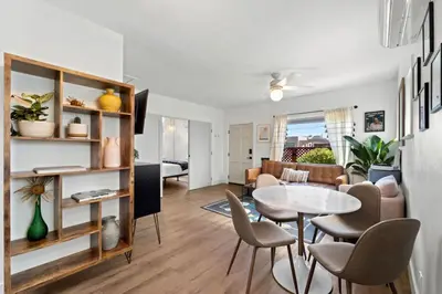 a living room with a table and chairs at North Park Boho Bungalow by Rather Be Properties in San Diego