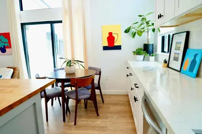 a kitchen with a table and chairs and a dining room at Private Family Friendly Guest Home in San Diego