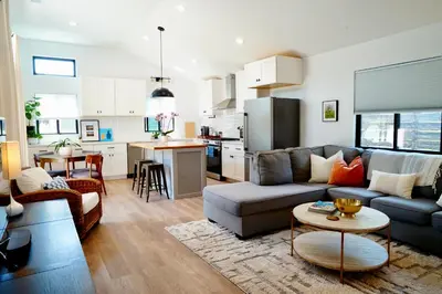 a living room with a couch and a table at Private Family Friendly Guest Home in San Diego