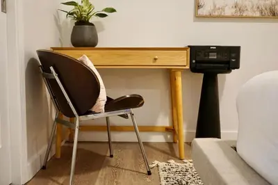 a desk with a chair next to a couch at Private Family Friendly Guest Home in San Diego
