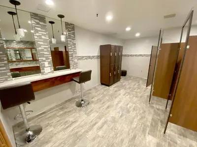 a bathroom with a vanity and a sink and mirrors at C302 - Surfside Sactuary in Oceanside