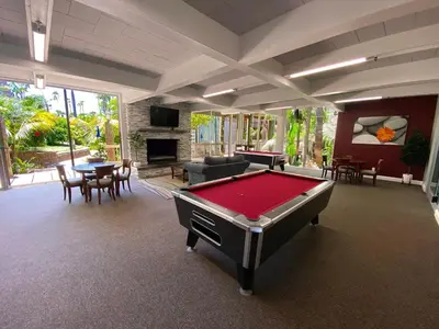 a living room with a pool table in it at C302 - Surfside Sactuary in Oceanside