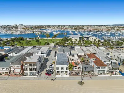 an aerial view of a beach with houses and a harbor at 1628 West Oceanfront Oasis 2 in Newport Beach