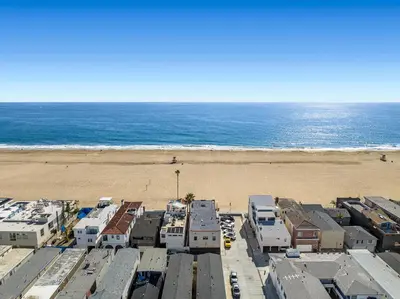 an aerial view of a beach with houses and the ocean at 1628 West Oceanfront Oasis 3 in Newport Beach