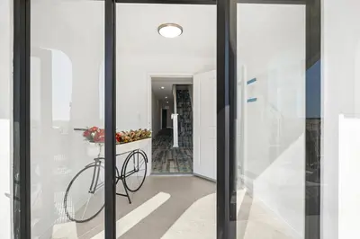 a bicycle is in the hallway of a house at 1628 West Oceanfront Oasis 3 in Newport Beach