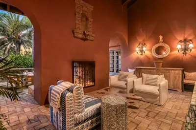 a living room with chairs and a fireplace at Exclusive Spanish Mediterranean Mansion in Rancho Santa Fe