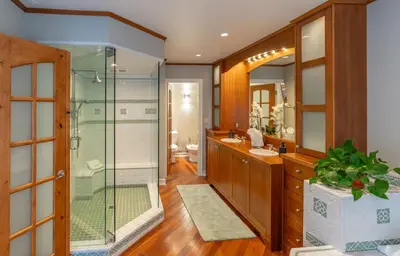 a bathroom with a glass shower and a sink at Dolphin's Paradise in San Diego