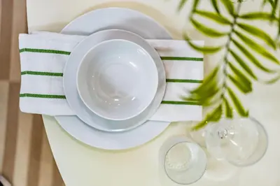 a table with a plate and a cup on a table at Quaint Studio in Charming Marston Hills in San Diego