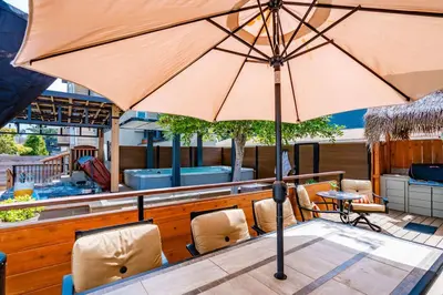 a large umbrella sitting on top of a table at PB Compound Getaway Steps to Surf and Sand in San Diego
