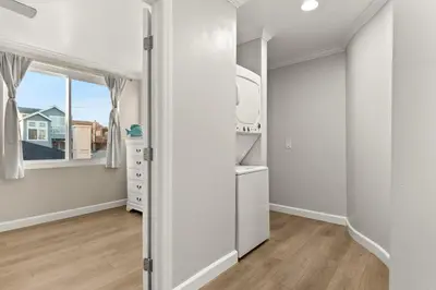 an empty room with a closet and a window at Mission Beach Marvel in San Diego