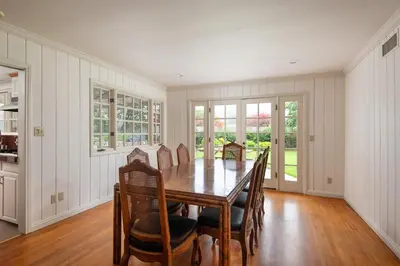 a dining room with a wooden table and chairs at La Jolla Shores Family Getaway in San Diego