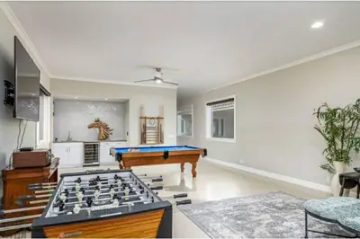 a living room with a pool table and a billiards at Luxurious Mansion in Wine Country in Temecula
