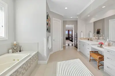a large white bathroom with a tub and a sink at Luxurious Mansion in Wine Country in Temecula