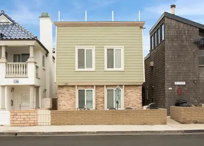 a house on the side of a street at Lower West Newport in Newport Beach