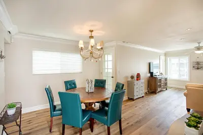 a dining room with a table and chairs at Lower West Newport in Newport Beach