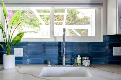 a bathroom with a sink and a window at Chic Studio Suite Serene Backyard in Heart of SD in San Diego