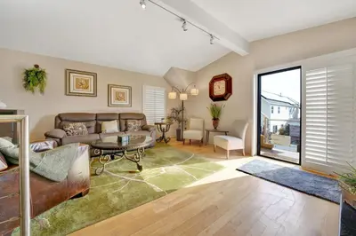 a living room with a couch and a table at 4 Bedrooms in Newport Beach
