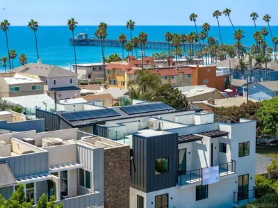 an aerial view of houses and the beach at Rooftop Home With Ocean View & Private Parking in Oceanside