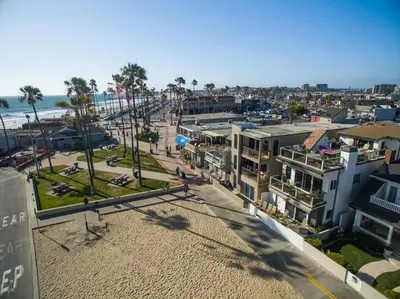 an aerial view of a city with a beach and buildings at Abigail - Beachfront in Newport Beach