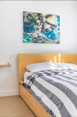 a bedroom with a bed with a picture on the wall at Alexander - Oceanview in Newport Beach